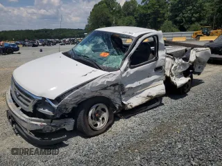 2002 Ford F-150 XL with VIN 1FTRF17282NB09380, listed as a Copart auction lot 62017964 with 0 mi miles and Salvage Title. Bid and sale history available at carsss.com. Image 1.