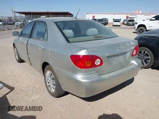 2004 Toyota Corolla CE with VIN 1NXBR32E64Z283247, listed as a IAAI auction lot 42121254 with 292,754 mi miles. Bid and sale history available at carsss.com. Image 3.