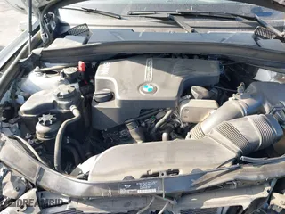 2014 BMW X1 xDrive28i with VIN WBAVL1C52EVY23658, listed as a IAAI auction lot 41153436 with 26,791 mi miles. Bid and sale history available at carsss.com. Image 10.