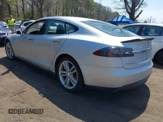 2015 Tesla Model S 85D with VIN 5YJSA1H2XFF084145, listed as a IAAI auction lot 42101755 with 105,660 mi miles. Bid and sale history available at carsss.com. Image 3.