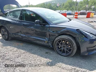 2023 Tesla Model 3 with VIN 5YJ3E1EA2PF566047, listed as a IAAI auction lot 42481008 with 21,143 mi miles and . Bid and sale history available at DreamBid. Image 6.