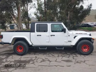 2021 Jeep Gladiator Willys with VIN 1C6HJTAG1ML572638, listed as a IAAI auction lot 42065562 with 43,040 mi miles and . Bid and sale history available at DreamBid. Image 13.