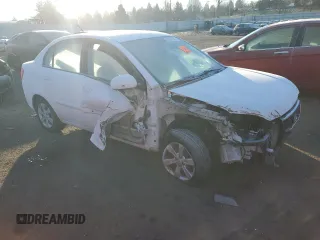 2010 Kia Rio LX with VIN KNADH4A35A6691869, listed as a Copart auction lot 42025785 with 126,381 mi miles and Salvage Title. Bid and sale history available at carsss.com. Image 4.