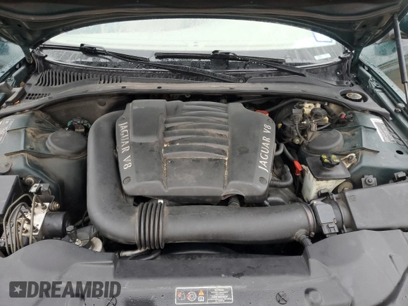 2002 Jaguar S-Type with VIN SAJDA01P12GM27242, listed as a Copart auction lot 88579215 with 218,546 mi miles and Salvage Title. Bid and sale history available at DreamBid. Image 11.