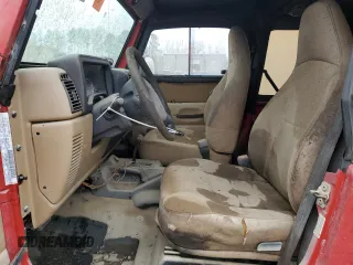 2002 Jeep Wrangler SE with VIN 1J4FA29P32P706533, listed as a Copart auction lot 43709055 with Not Provided miles and Salvage Title. Bid and sale history available at DreamBid. Image 7.
