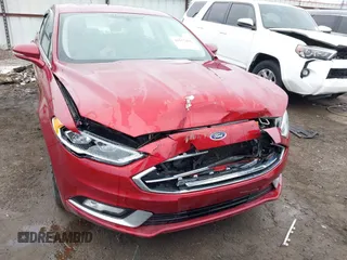 2017 Ford Fusion SE z VIN 3FA6P0H98HR175087, wystawiony jako IAAI lot #41557481 z przebiegiem 103 752 mil mil oraz . Historia ofert i sprzedaży dostępna na DreamBid. Obrazek 6.