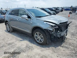 2023 Cadillac XT5 FWD Premium Luxury with VIN 1GYKNCRS3PZ135585, listed as a Copart auction lot 58891914 with 32,325 mi miles and Salvage Title. Bid and sale history available at carsss.com. Image 4.