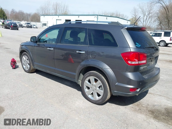 2014 Dodge Journey Limited with VIN 3C4PDDDG7ET138601, listed as a IAAI auction lot 42021766 with 214,220 mi miles and . Bid and sale history available at carsss.com. Image 3.