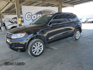 2013 Volkswagen Touareg Lux with VIN WVGEF9BPXDD001489, listed as a Copart auction lot 55898945 with 96,477 mi miles and Clean Title. Bid and sale history available at DreamBid. Image 1.