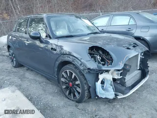 2016 MINI Cooper Hardtop 4 Door S with VIN WMWXU3C56G2B63682, listed as a IAAI auction lot 41244676 with 110,902 mi miles. Bid and sale history available at carsss.com. Image 1.