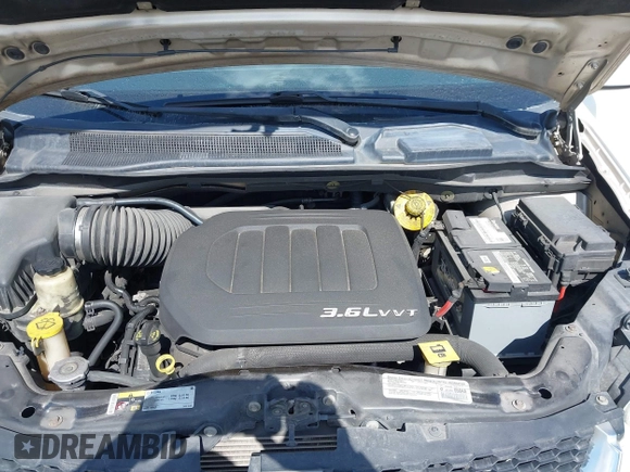 2014 Dodge Grand Caravan SXT with VIN 2C4RDGCGXER322705, listed as a IAAI auction lot 42170301 with 147,070 mi miles and . Bid and sale history available at DreamBid. Image 10.