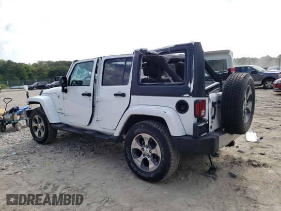 2018 Jeep Wrangler JK Unlimited Sahara with VIN 1C4BJWEG7JL856975, listed as a Copart auction lot 59562484 with 101,419 mi miles and Salvage Title. Bid and sale history available at carsss.com. Image 2.