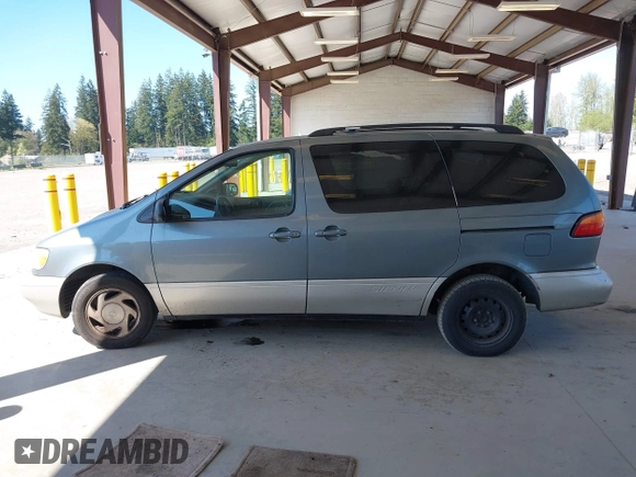 1999 Toyota Sienna LE with VIN 4T3ZF13C4XU166786, listed as a IAAI auction lot 42057995 with 316,259 mi miles. Bid and sale history available at carsss.com. Image 14.