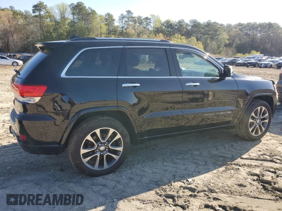 2017 Jeep Grand Cherokee Overland with VIN 1C4RJFCT3HC755960, listed as a Copart auction lot 52268895 with 99,998 mi miles and Salvage title. Bid and sale history available at DreamBid. Image 3.