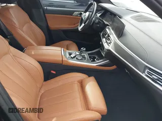 2021 BMW X7 M50i with VIN 5UXCX6C07M9G39230, listed as a IAAI auction lot 41409366 with 63,965 mi miles. Bid and sale history available at carsss.com. Image 5.