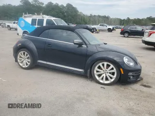 2014 Volkswagen Beetle 1.8T w/Premium z VIN 3VW517AT6EM816698, wystawiony jako Copart lot #57344055 z przebiegiem 52 782 mil mil oraz Szkody całkowita. Historia ofert i sprzedaży dostępna na DreamBid. Obrazek 4.