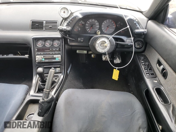 1989 Nissan Skyline z VIN HNR32002973, wystawiony jako Copart lot #73699504 z przebiegiem 72 824 mil mil oraz Szkoda całkowita • Salvage title. Historia ofert i sprzedaży dostępna na DreamBid. Obrazek 8.