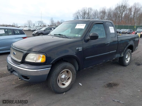 2000 Ford F-150 XL with VIN 1FTRX18WXYNC25817, listed as a IAAI auction lot 41976618 with 148,794 mi miles. Bid and sale history available at carsss.com. Image 2.