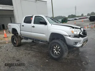 2013 Toyota Tacoma with VIN 5TFLU4EN8DX065656, listed as a Copart auction lot 63486165 with 185,018 mi miles and Salvage title. Bid and sale history available at DreamBid. Image 4.