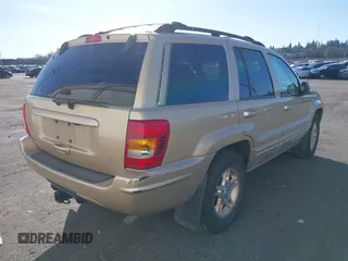 1999 Jeep Grand Cherokee Limited with VIN 1J4GW68N3XC688112, listed as a IAAI auction lot 41640033 with 196,851 mi miles. Bid and sale history available at carsss.com. Image 4.
