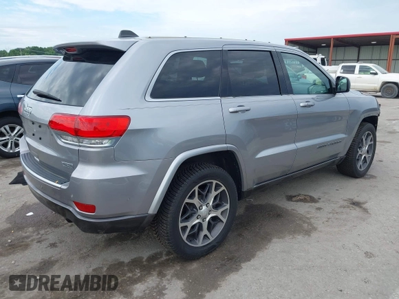 2018 Jeep Grand Cherokee Limited with VIN 1C4RJFBG7JC266715, listed as a IAAI auction lot 42562005 with 101,999 mi miles and . Bid and sale history available at DreamBid. Image 4.