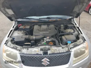 2006 Suzuki Grand Vitara z VIN JS3TE941764101657, wystawiony jako Copart lot #54943205 z przebiegiem 206 744 mil mil oraz Szkody całkowita. Historia ofert i sprzedaży dostępna na DreamBid. Obrazek 12.