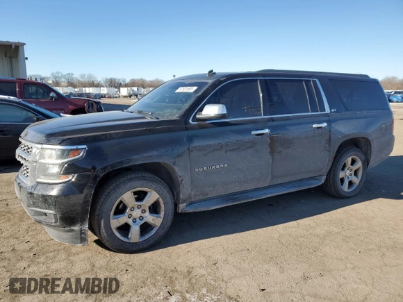 2015 Chevrolet Suburban LT with VIN 1GNSKJKC2FR274506, listed as a Copart auction lot 87881695 with 196,506 mi miles and Salvage Title. Bid and sale history available at DreamBid. Image 1.