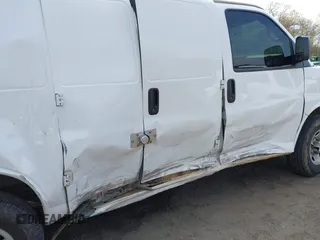 2014 Chevrolet Express Cargo Van with VIN 1GCWGFCA7E1110011, listed as a IAAI auction lot 41983301 with 114,827 mi miles. Bid and sale history available at carsss.com. Image 6.