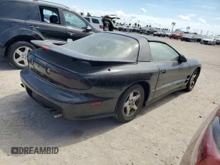 2000 Pontiac Firebird Formula z VIN 2G2FV22G9Y2140113, wystawiony jako Copart lot #76135324 z przebiegiem Nie podano mil oraz Szkody całkowita. Historia ofert i sprzedaży dostępna na DreamBid. Obrazek 3.