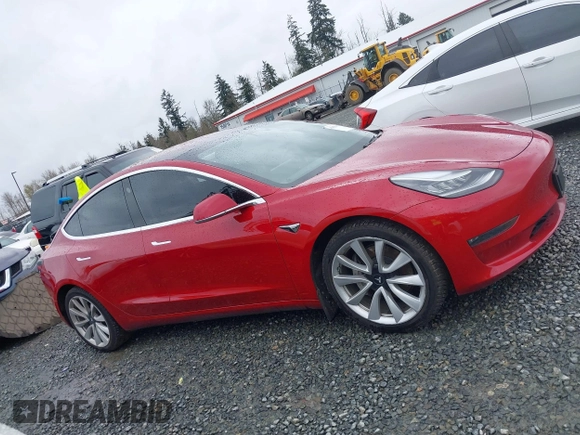 2018 Tesla Model 3 Long Range Battery z VIN 5YJ3E1EB2JF087823, wystawiony jako IAAI lot #41903609 z przebiegiem 69 749 mil mil oraz . Historia ofert i sprzedaży dostępna na DreamBid. Obrazek 14.