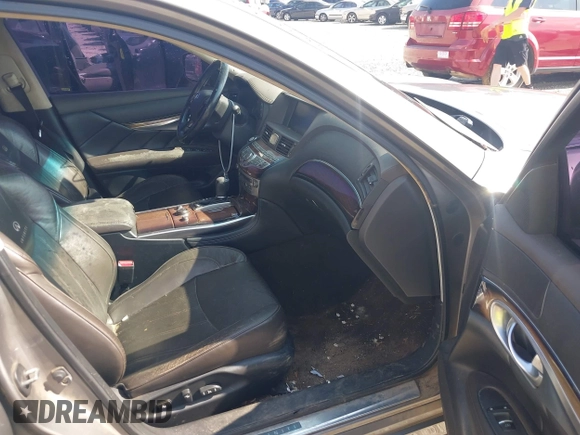 2011 Infiniti M with VIN JN1BY1AR2BM374001, listed as a IAAI auction lot 41544244 with 235,343 mi miles and . Bid and sale history available at DreamBid. Image 5.