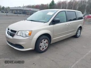 2012 Dodge Grand Caravan SE with VIN 2C4RDGBG4CR298996, listed as a IAAI auction lot 42133423 with 70,354 mi miles and . Bid and sale history available at DreamBid. Image 2.