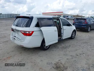 2011 Honda Odyssey EX-L with VIN 5FNRL5H67BB011070, listed as a IAAI auction lot 42491685 with 200,671 mi miles and . Bid and sale history available at DreamBid. Image 4.