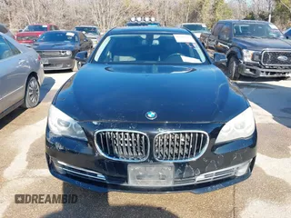 2013 BMW 7 Series 740i with VIN WBAYA6C55DC995094, listed as a IAAI auction lot 41246796 with 164,394 mi miles. Bid and sale history available at carsss.com. Image 6.