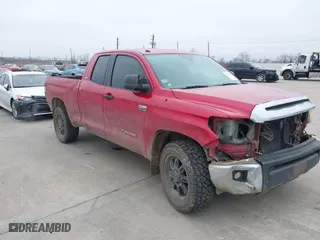 2014 Toyota Tundra 4WD Truck SR with VIN 5TFUW5F1XEX415595, listed as a IAAI auction lot 41426947 with 145,641 mi miles. Bid and sale history available at carsss.com. Image 1.