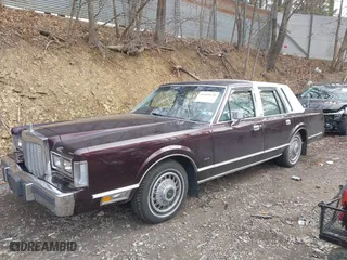 1987 Lincoln Town Car with VIN 1LNBM81F5HY704217, listed as a IAAI auction lot 41855678 with 86,794 mi miles. Bid and sale history available at carsss.com. Image 2.
