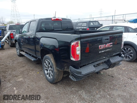 2021 GMC Canyon 4WD Denali z VIN 1GTG6EEN6M1260580, wystawiony jako IAAI lot #41918693 z przebiegiem 52 085 mil mil oraz . Historia ofert i sprzedaży dostępna na DreamBid. Obrazek 3.