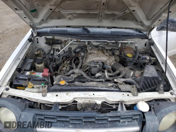 2003 Nissan Xterra XE z VIN 5N1ED28TX3C649100, wystawiony jako Copart lot #58615605 z przebiegiem 199 355 mil mil oraz Szkoda całkowita • Salvage title. Historia ofert i sprzedaży dostępna na DreamBid. Obrazek 11.