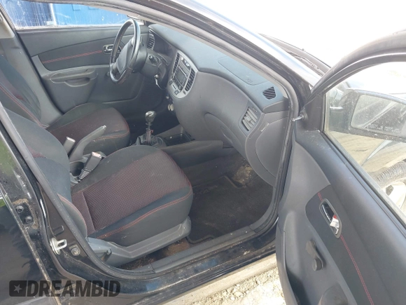 2009 Kia Rio LX with VIN KNADE223496561265, listed as a IAAI auction lot 42143889 with 235,634 mi miles and . Bid and sale history available at DreamBid. Image 5.