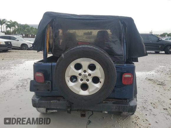 2003 Jeep Wrangler X with VIN 1J4FA39S93P315950, listed as a Copart auction lot 59563295 with Not provided miles and Salvage title. Bid and sale history available at DreamBid. Image 6.