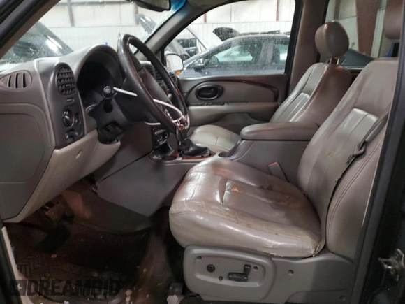 2002 Oldsmobile Bravada z VIN 1GHDT13S522107056, wystawiony jako Copart lot #86296454 z przebiegiem 169 856 mil mil oraz Tytuł czysty. Historia ofert i sprzedaży dostępna na DreamBid. Obrazek 7.