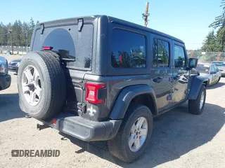 2019 Jeep Wrangler Unlimited Sport S with VIN 1C4HJXDG2KW558562, listed as a IAAI auction lot 42100717 with Not provided miles and . Bid and sale history available at DreamBid. Image 4.