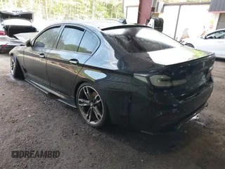 2018 BMW 5 Series M550i xDrive with VIN WBAJB9C51JB035949, listed as a IAAI auction lot 42085727 with Not provided miles and . Bid and sale history available at DreamBid. Image 3.