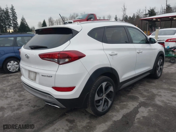 2017 Hyundai Tucson Value with VIN KM8J33A28HU301869, listed as a IAAI auction lot 41288511 with 111,143 mi miles. Bid and sale history available at carsss.com. Image 4.