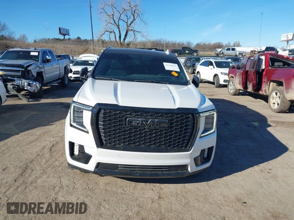 2021 GMC Yukon XL Denali with VIN 1GKS2JKT1MR401207, listed as a IAAI auction lot 41242619 with 87,902 mi miles and . Bid and sale history available at carsss.com. Image 12.