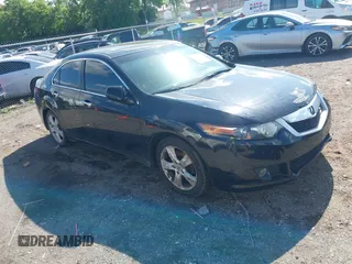 2009 Acura TSX with VIN JH4CU26659C011482, listed as a IAAI auction lot 42212079 with 243,119 mi miles. Bid and sale history available at carsss.com. Image 1.