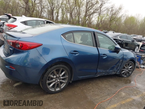 2018 Mazda 3 Touring with VIN 3MZBN1V35JM217641, listed as a IAAI auction lot 41943433 with 64,884 mi miles. Bid and sale history available at carsss.com. Image 13.