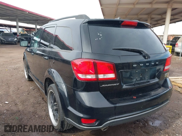 2014 Dodge Journey SXT with VIN 3C4PDCBG1ET127798, listed as a IAAI auction lot 41799898 with 178,873 mi miles and . Bid and sale history available at DreamBid. Image 3.