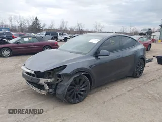 2023 Tesla Model Y Performance with VIN 7SAYGDEF2PF757113, listed as a IAAI auction lot 41881175 with 54,809 mi miles and . Bid and sale history available at DreamBid. Image 2.