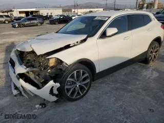 2020 BMW X2 sDrive28i with VIN WBXYH9C02L5N88845, listed as a Copart auction lot 43734055 with 37,923 mi miles and Salvage Title. Bid and sale history available at carsss.com. Image 1.